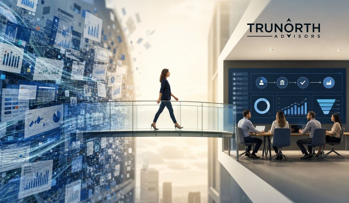 A woman walks on a glass bridge from a digital, data-filled space powered by AI to a meeting room where people discuss business with charts on a screen. The TruNorth Advisors logo is visible on the wall.